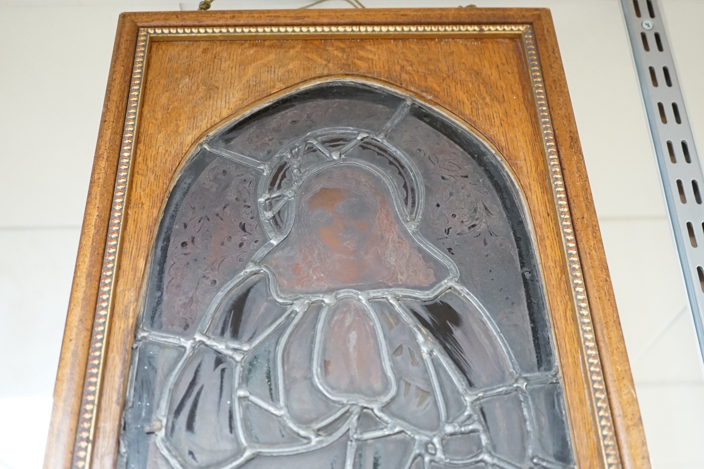 A pair of Victorian framed stained glass panels of St. Martin and St. Simon. 68.5cm tall